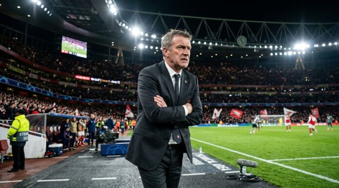 প্রিমিয়ার লিগের ম্যাচে ডাগআউটে চিন্তিত এক কোচের প্রতীকী চিত্র।